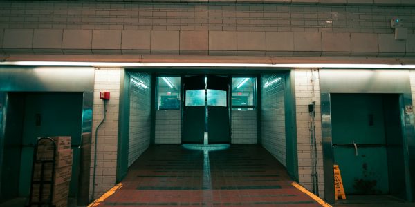 a building with two doors and a ramp leading to it